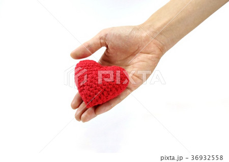 ็Hand giving red crocheted heart. Valentine's Day. ็Hand giving red crocheted heart. Valentine's Day. 36932558