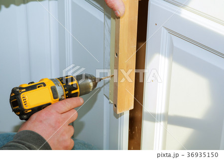 Worker use drill to repair furnitureand drills 36935150