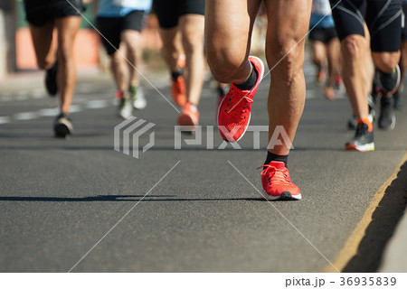 Marathon running in the light of evening 36935839