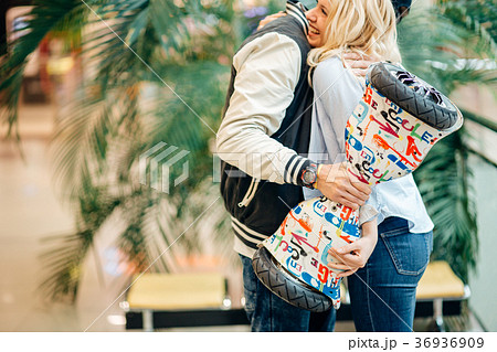 man abd woman hugging after boyfriend give gift 36936909
