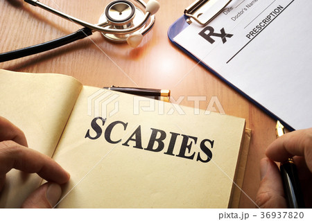 Book with title Scabies on a table. 36937820
