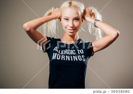 fashion portrait of a young woman holding her long 36938080