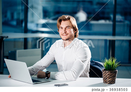 Business man or accountant working on laptop Business man or accountant working on laptop 36938503