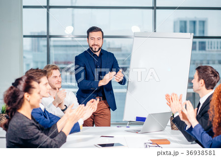Businessman presenting to colleagues at meeting 36938581