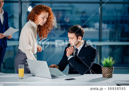 Worried man receiving notification from colleague 36938593