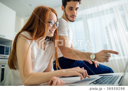 couple with laptop spending time together at home couple with laptop spending time together at home 36939298