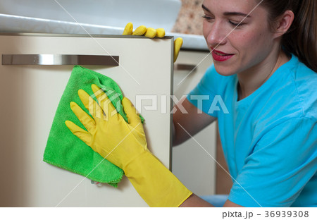 Charming woman doing cleaning Charming woman doing cleaning 36939308