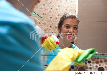 Charming woman doing cleaning Charming woman doing cleaning 36939319