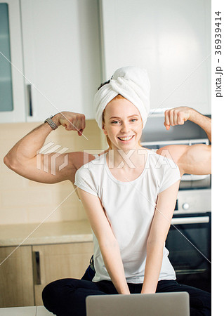 man showing strength of woman by biceps behind her man showing strength of woman by biceps behind her 36939414
