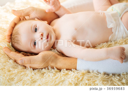 newborn baby lying down smiling looking at camera 36939683