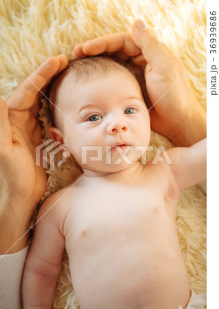 Baby looking at camera, lay on white blanket Baby looking at camera, lay on white blanket 36939686