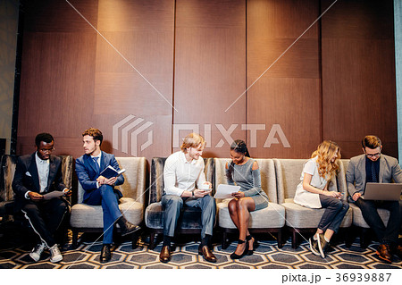 Business people waiting for job interview, talking Business people waiting for job interview, talking 36939887