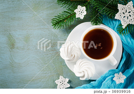 Delicious meringue cookies and cup of hot tea. 36939916