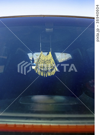 Air freshener hanging in the car on the rear view 36940604