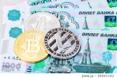 Cryptocurrency coins lying on the russian ruble 36941102