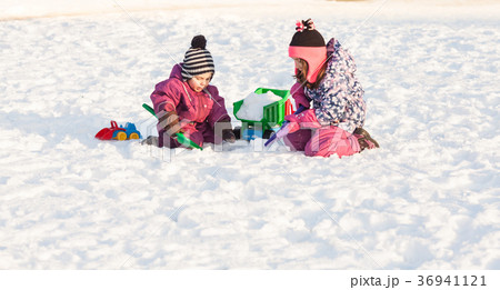 Children play on the snow Children play on the snow 36941121