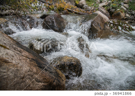 Strong flow of water in mountain river with Strong flow of water in mountain river with 36941866