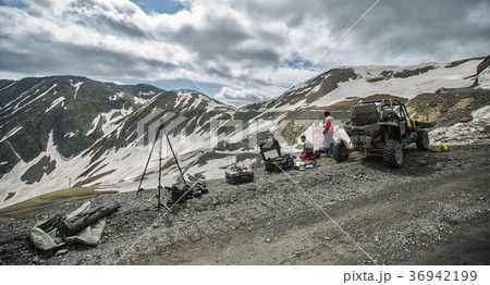 Buggy mountains driving on the road with snow 36942199
