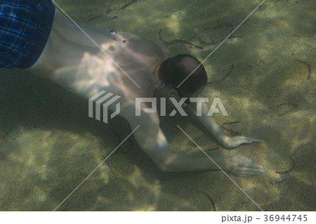 Tourist man in swimming sports glasses swimming 36944745
