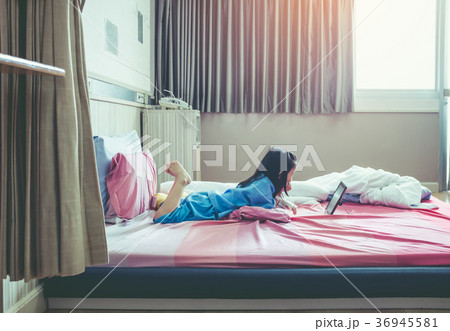 Cute asian child using tablet with iv drip on hand 36945581