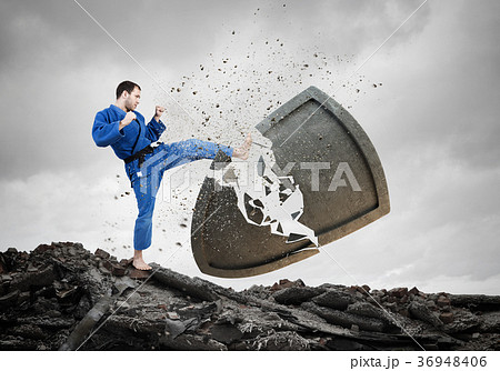 Karate man in blue kimino Karate man in blue kimino 36948406