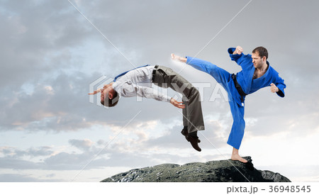 Karate man in blue kimino Karate man in blue kimino 36948545
