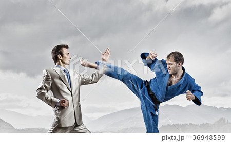 Karate man in blue kimino Karate man in blue kimino 36948599