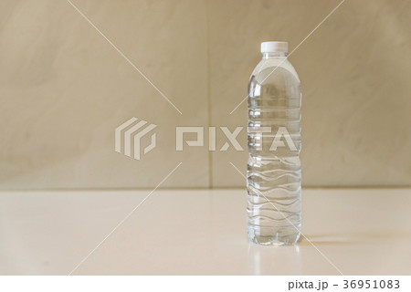 Bottle of water on white table Bottle of water on white table 36951083