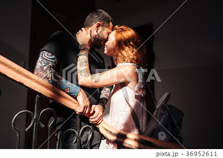 guy and girl are posing on the stairs guy and girl are posing on the stairs 36952611