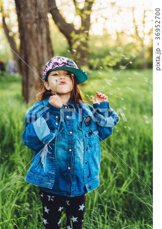 little, beautiful girl on the lawn 36952700