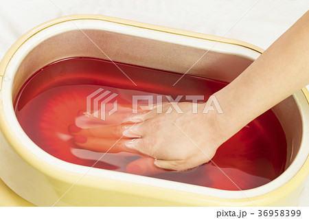 Process paraffin treatment of female hands in beau 36958399