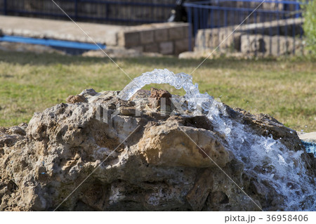 A source of pure mineral water from a stone A source of pure mineral water from a stone 36958406