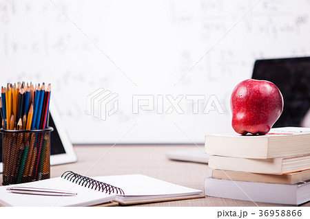 Books, notebook and pencils on table with a 36958866