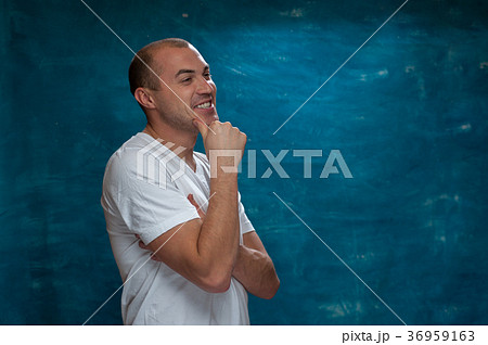 Cute man posing on blue background 36959163