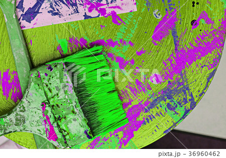 Paints and brushes on dirty background 36960462