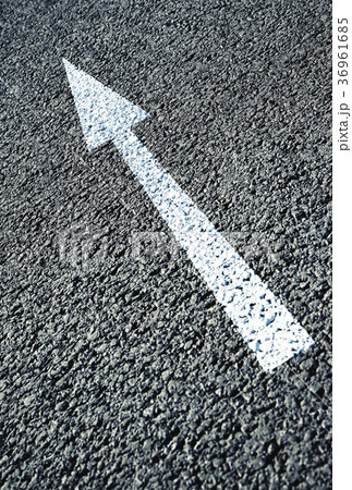 white arrow on the asphalt road white arrow on the asphalt road 36961685