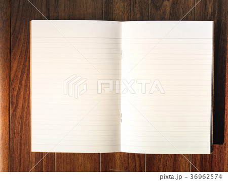 Open note book on wood table 36962574