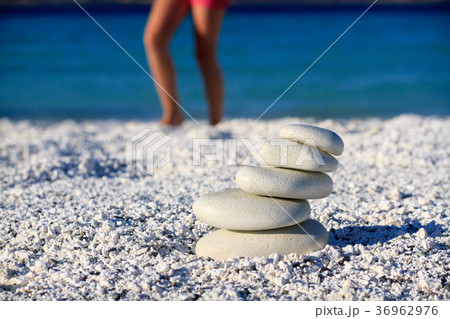 body of a girl in a meditation on the beach 36962976