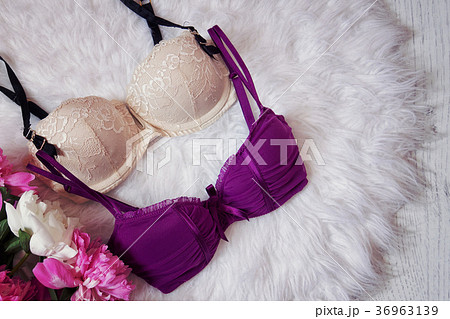 Beige and purple bodice on white fur 36963139