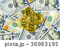 Gold Bit Coin BTC coins rotating on bills of 100 36963195