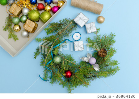 Making a Christmas wreath. Christmas balls, ribbon 36964130