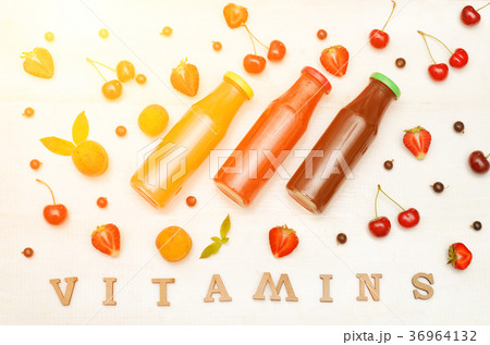 Three bottles with juice, fruit. Vitamins  Three bottles with juice, fruit. Vitamins  36964132