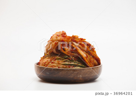 Kimchi in a wooden bowl isolated Kimchi in a wooden bowl isolated 36964201
