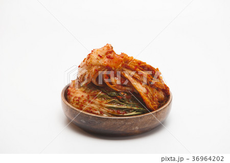 Kimchi in a wooden bowl isolated Kimchi in a wooden bowl isolated 36964202