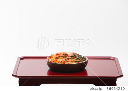 Kimchi in wooden bowl on wood desk 36964210