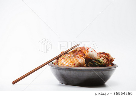 Chopsticks with kimchi in crock head isolated Chopsticks with kimchi in crock head isolated 36964266