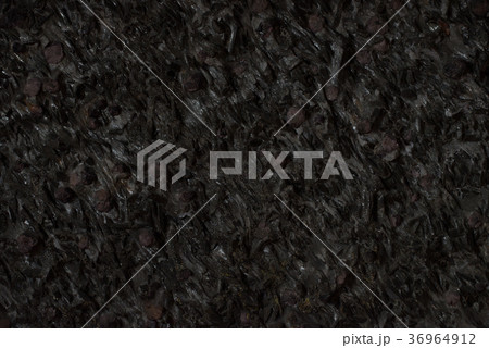 Natural black stone texture closeup, dark grey Natural black stone texture closeup, dark grey 36964912