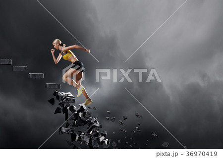 Sports woman overcoming challenges 36970419