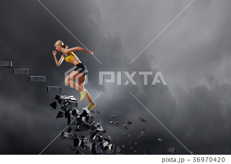 Sports woman overcoming challenges 36970420