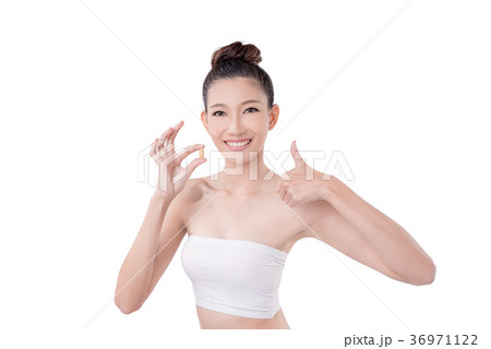 Woman holding vitamin over white background 36971122
